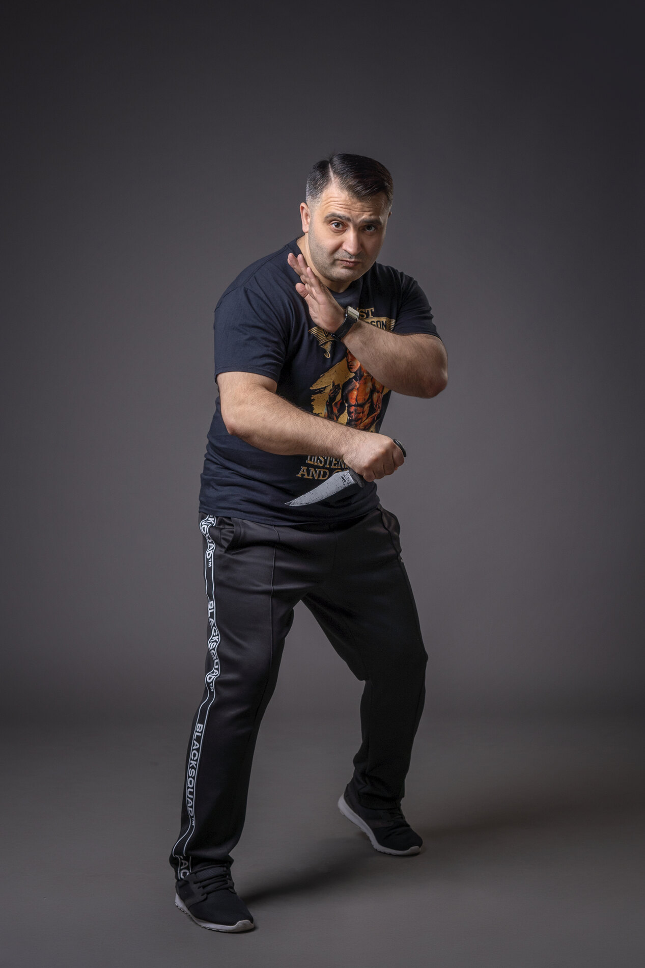 Grandmaster Vidadi Hajiyev demonstrating a reverse-grip knife fighting stance